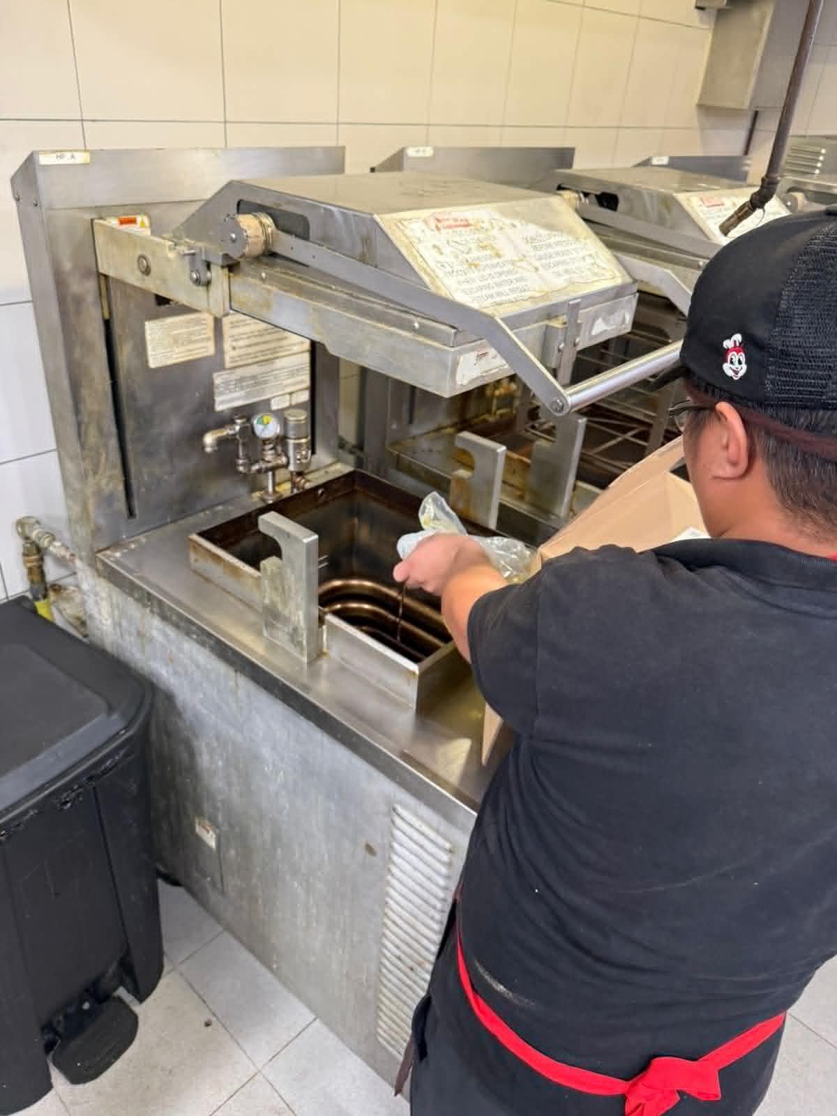 Technician servicing a commercial fryer
