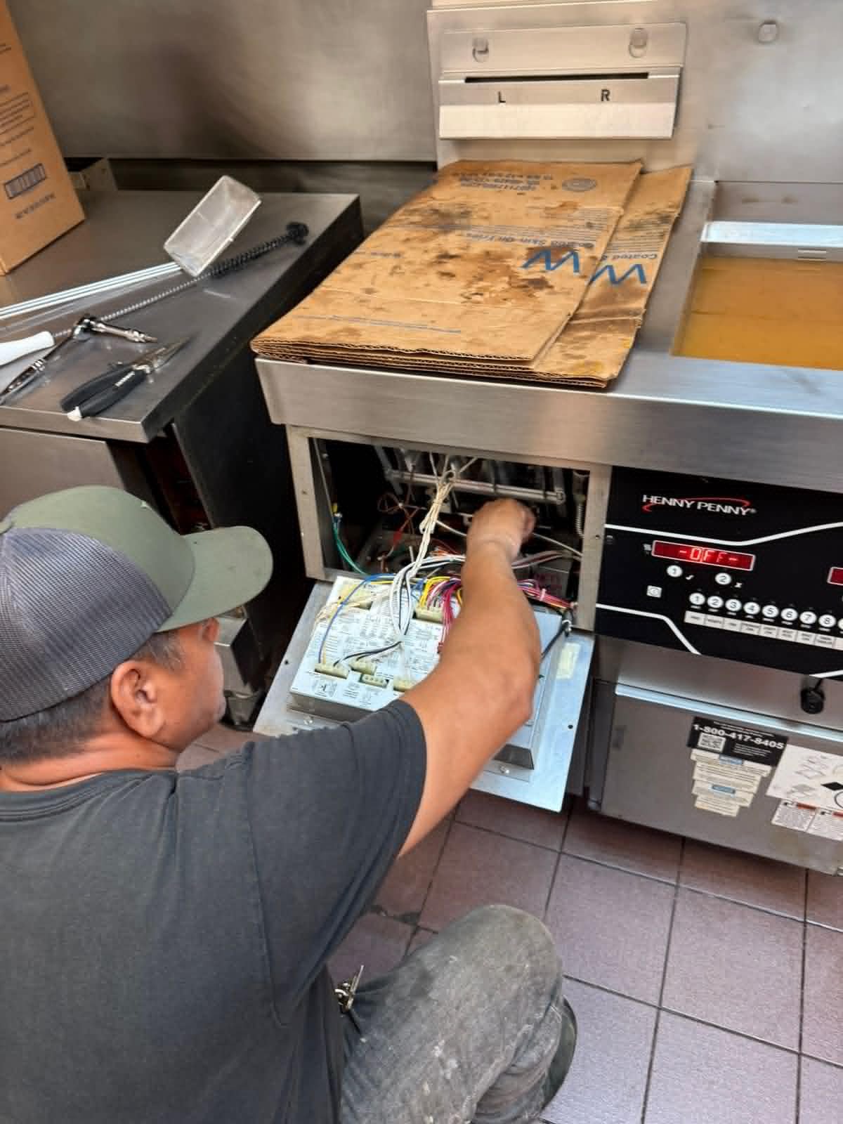 Commercial fryer maintenance in a kitchen